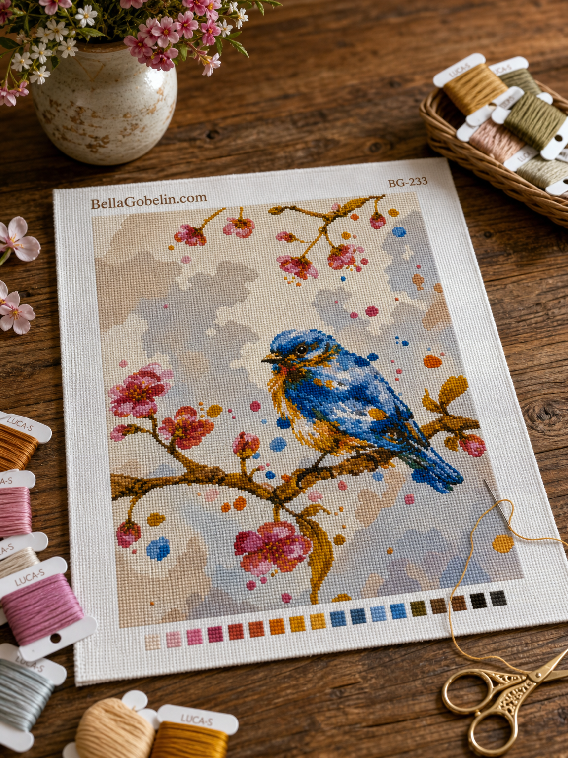 Blue bird on a blooming branch